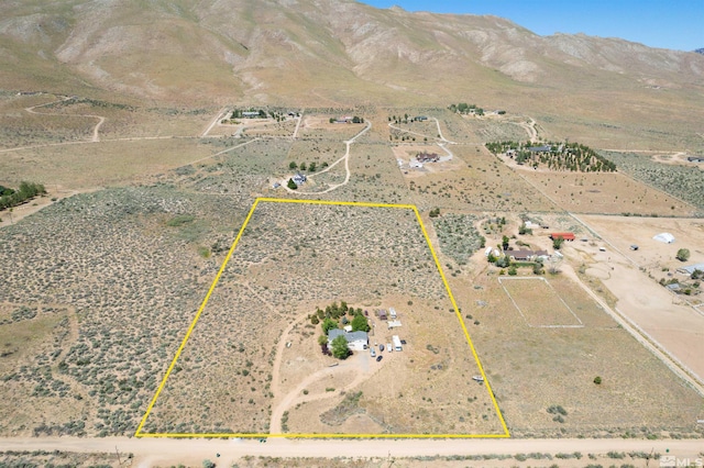 180 Shetland Cir, Reno, NV 89508 - aerial view of sparsely populated area featuring property parcel outlined and a mountainous background