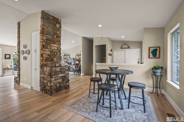 4400 Bridle Way, Reno, NV 89519 - dining area with lofted ceiling, light wood-type flooring, ornate columns, baseboards, and recessed lighting