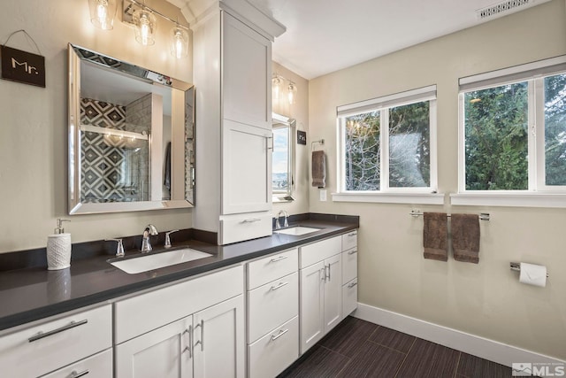 4400 Bridle Way, Reno, NV 89519 - full bathroom featuring plenty of natural light, a shower stall, baseboards, and double vanity