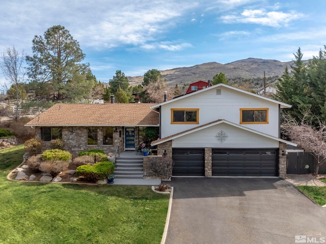 4400 Bridle Way, Reno, NV 89519 - split level home with a mountain view, driveway, a garage, and stone siding