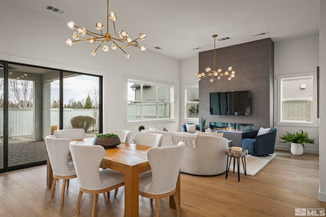 605 Braided Rope Dr, Reno, NV 89511 - dining area featuring a chandelier and light wood-style flooring
