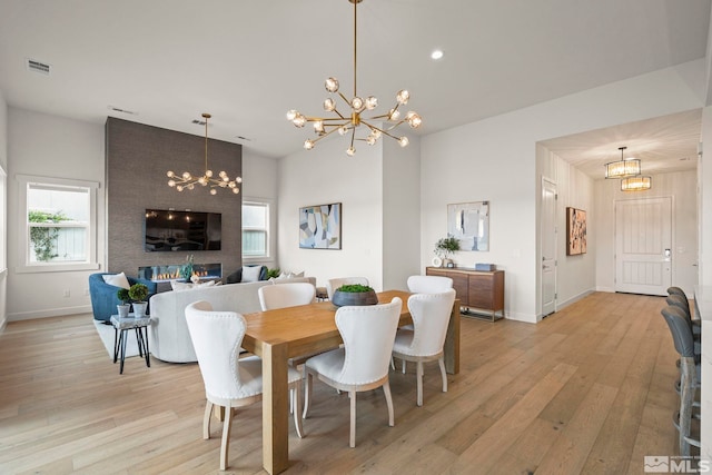 605 Braided Rope Dr, Reno, NV 89511 - dining area with a chandelier, light wood-type flooring, baseboards, and recessed lighting