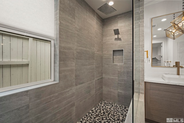605 Braided Rope Dr, Reno, NV 89511 - full bathroom featuring a tile shower, vanity, recessed lighting, and a chandelier