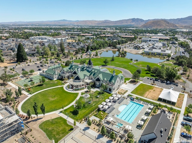 605 Braided Rope Dr, Reno, NV 89511 - aerial view of property and surrounding area featuring a water and mountain view, a pool area, and nearby suburban area