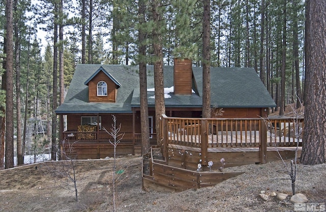 100 Timber Ln, Markleeville, CA 96120 - rustic home with a chimney, roof with shingles, and a wooden deck