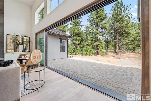5192 Bordeaux Dr, Reno, NV 89511 - doorway to outside featuring wood finished floors and a towering ceiling