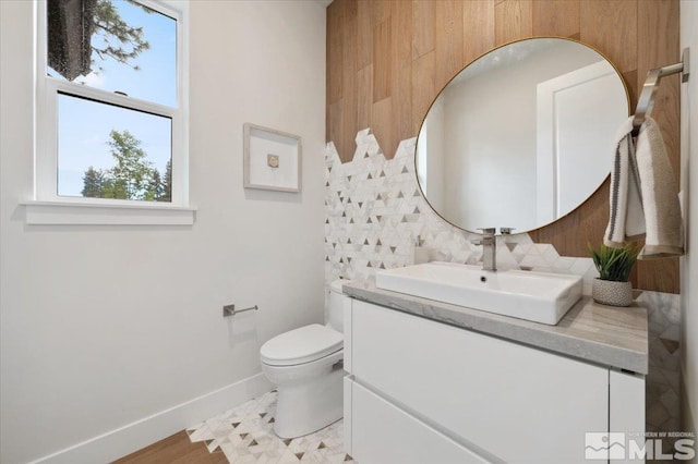 5192 Bordeaux Dr, Reno, NV 89511 - half bathroom with tasteful backsplash, vanity, baseboards, and toilet