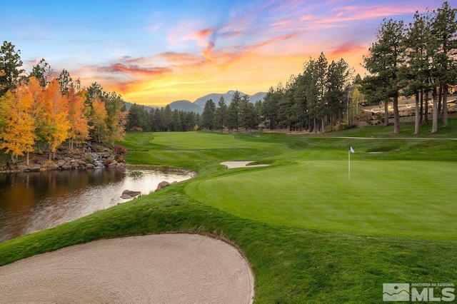 5192 Bordeaux Dr, Reno, NV 89511 - surrounding community featuring view of golf course, a water and mountain view, and an area to practice putting