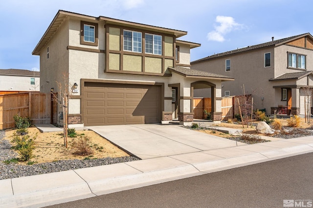 432 Summer Triangle, Reno, NV 89506 - view of front of house with fence, stucco siding, an attached garage, and concrete driveway