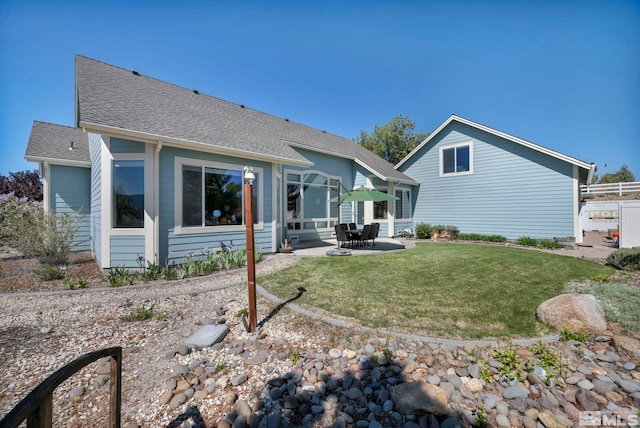 1655 Chiquita Cir, Minden, NV 89423 - back of house with a patio, roof with shingles, and a lawn
