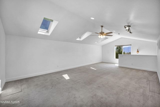 1655 Chiquita Cir, Minden, NV 89423 - bonus room with a skylight, vaulted ceiling, carpet floors, ceiling fan, and baseboards