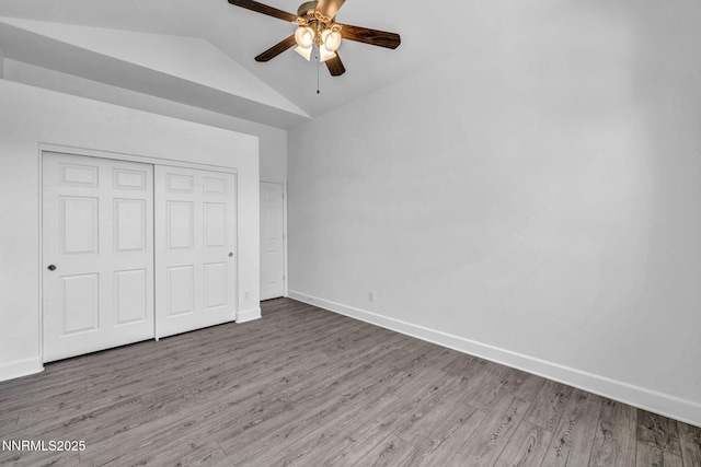 1655 Chiquita Cir, Minden, NV 89423 - unfurnished bedroom featuring wood finished floors, baseboards, vaulted ceiling, a closet, and ceiling fan