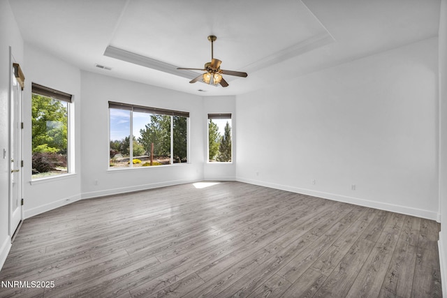 1655 Chiquita Cir, Minden, NV 89423 - spare room with hardwood / wood-style floors, a tray ceiling, ceiling fan, and baseboards