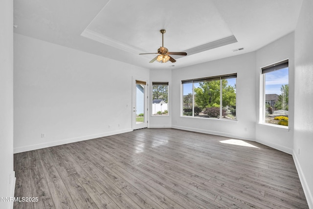 1655 Chiquita Cir, Minden, NV 89423 - empty room with a raised ceiling, plenty of natural light, and hardwood / wood-style flooring
