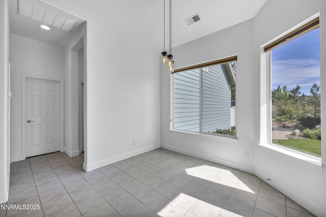 1655 Chiquita Cir, Minden, NV 89423 - empty room featuring light tile patterned floors, healthy amount of natural light, and baseboards