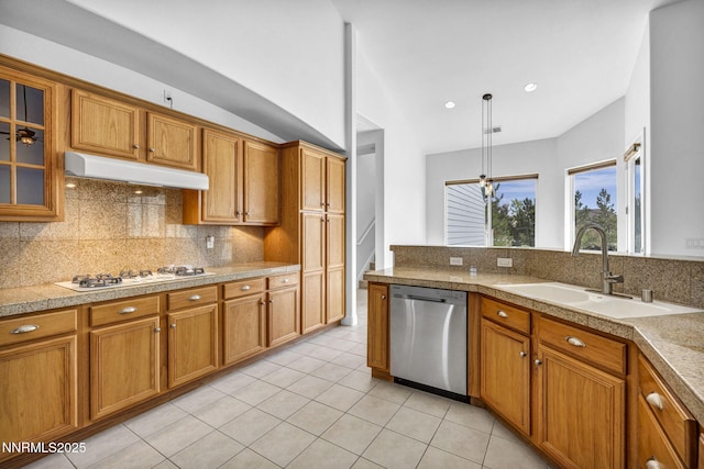 1655 Chiquita Cir, Minden, NV 89423 - kitchen featuring stainless steel dishwasher, under cabinet range hood, tile countertops, white gas cooktop, and brown cabinetry