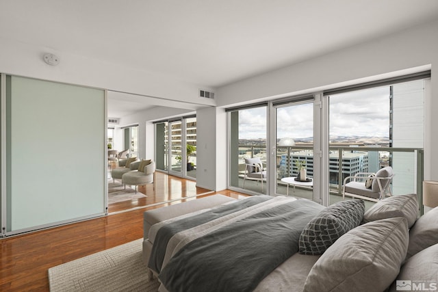 255 N Sierra St Unit 1011, Reno, NV 89501 - bedroom with access to exterior and wood finished floors