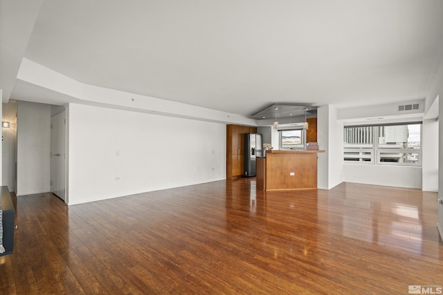 255 N Sierra St Unit 1011, Reno, NV 89501 - unfurnished living room featuring dark wood-type flooring