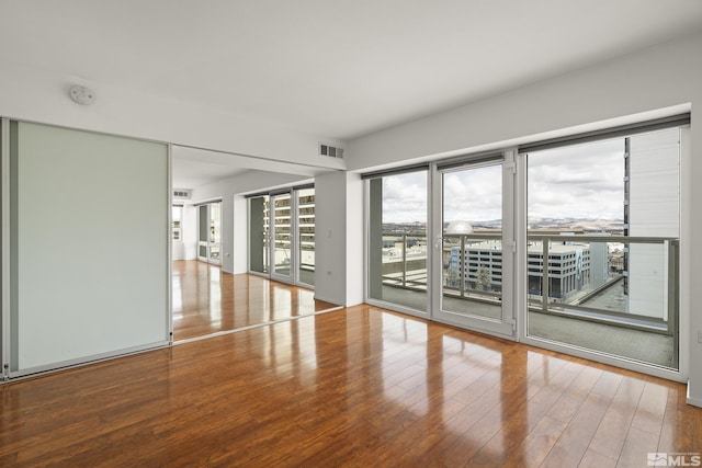 255 N Sierra St Unit 1011, Reno, NV 89501 - unfurnished room featuring wood finished floors and a smoke detector