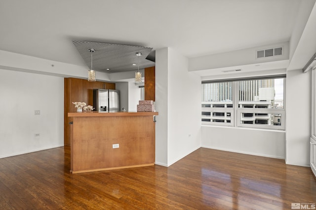 255 N Sierra St Unit 1011, Reno, NV 89501 - unfurnished living room featuring wood-type flooring and baseboards