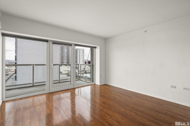 255 N Sierra St Unit 1011, Reno, NV 89501 - empty room with hardwood / wood-style floors and baseboards