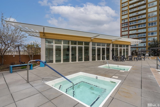 255 N Sierra St Unit 1011, Reno, NV 89501 - view of swimming pool featuring a community hot tub, a patio area, and fence