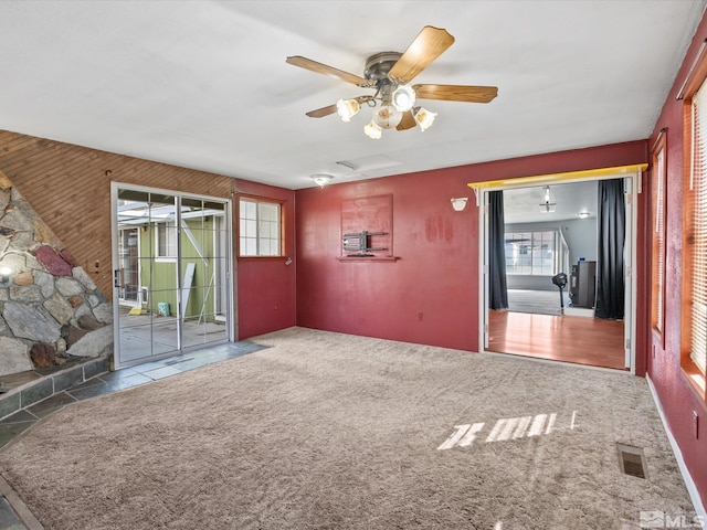 1248 Lindsay Ln, Carson City, NV 89706 - unfurnished room featuring ceiling fan and wood walls