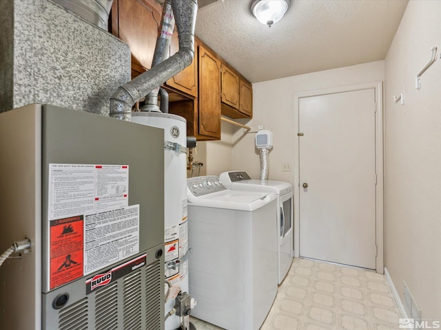 1248 Lindsay Ln, Carson City, NV 89706 - washroom featuring cabinet space, washer and clothes dryer, light flooring, a textured ceiling, and water heater