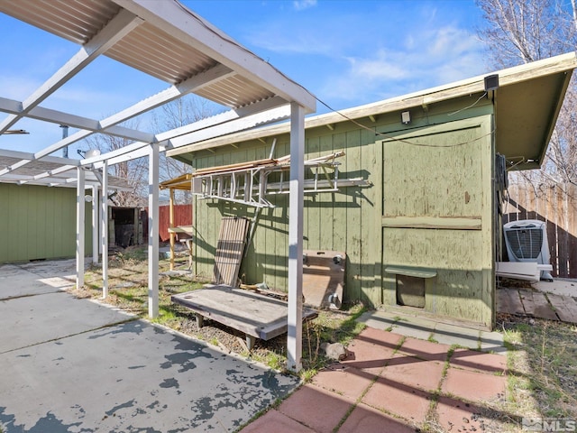 1248 Lindsay Ln, Carson City, NV 89706 - view of patio with a shed, central AC, an outdoor structure, a pergola, and fence