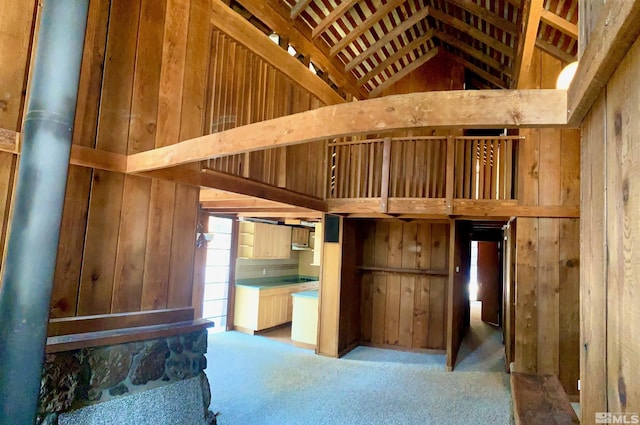 712 Lakeview Dr, Zephyr Cove, NV 89448 - unfurnished bedroom featuring wood walls, carpet floors, and vaulted ceiling