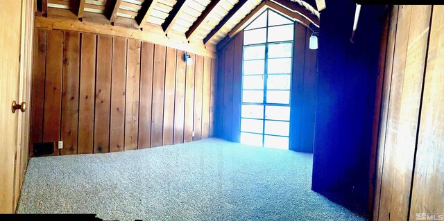 712 Lakeview Dr, Zephyr Cove, NV 89448 - carpeted spare room with wooden walls and vaulted ceiling