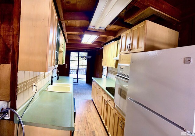 712 Lakeview Dr, Zephyr Cove, NV 89448 - kitchen with white appliances, a sink, light wood-style floors, and backsplash