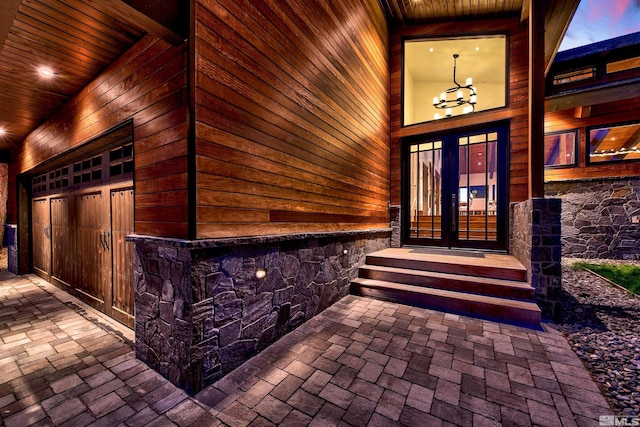 doorway to property with french doors and stone siding