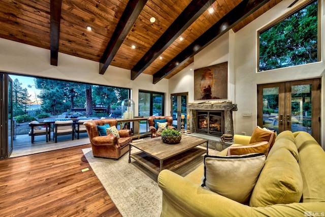 living room featuring wooden ceiling, high vaulted ceiling, beamed ceiling, wood finished floors, and french doors