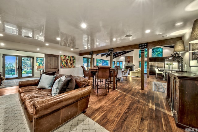 living room with recessed lighting, wood finished floors, and plenty of natural light