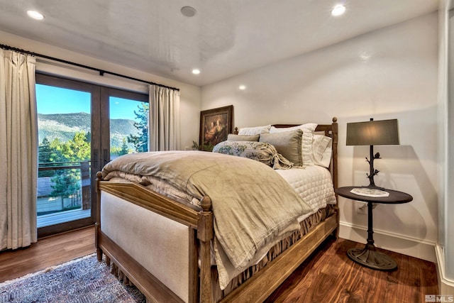 bedroom with access to outside, french doors, wood finished floors, recessed lighting, and baseboards