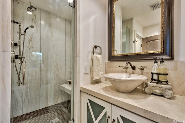 bathroom featuring a stall shower and vanity