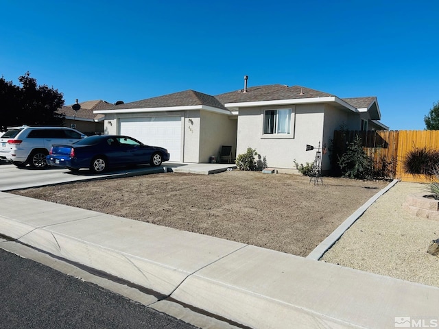 489 Torrey Pines Dr, Fallon, NV 89406 - single story home featuring a garage, stucco siding, fence, a shingled roof, and driveway