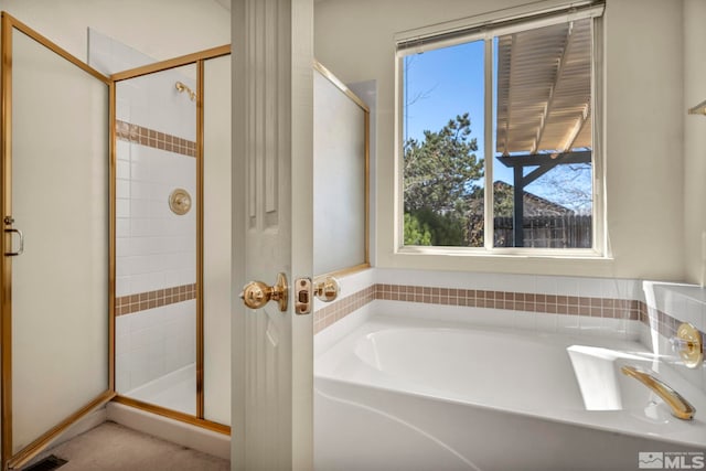 1675 Crestside Ct, Sparks, NV 89436 - bathroom featuring plenty of natural light, a stall shower, and a garden tub