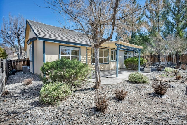 1675 Crestside Ct, Sparks, NV 89436 - back of house featuring a pergola, cooling unit, a fenced backyard, and a patio