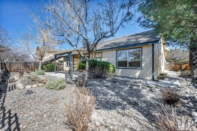 1675 Crestside Ct, Sparks, NV 89436 - ranch-style home featuring a pergola, a fenced backyard, and a patio area