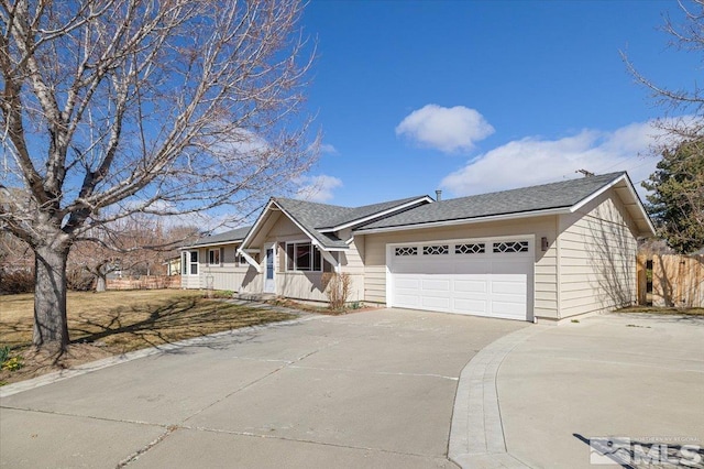 1116 Willow St, Gardnerville, NV 89410 - view of front of house with an attached garage, driveway, covered porch, and fence