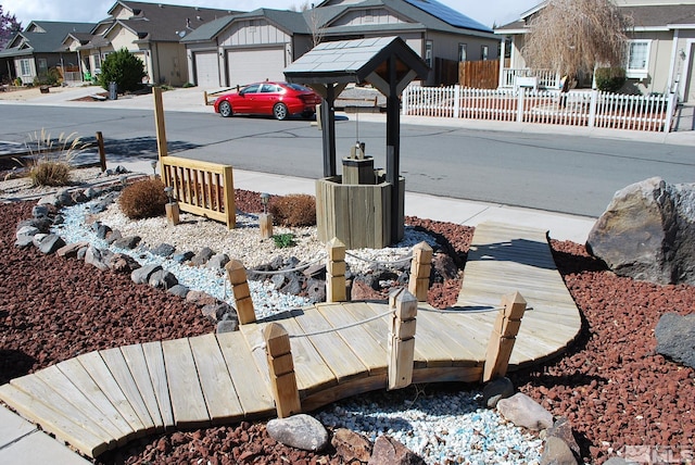 1075 Aster Ln, Fernley, NV 89408 - exterior view of fence, concrete driveway, and a residential view