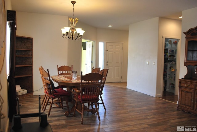 1075 Aster Ln, Fernley, NV 89408 - dining space featuring dark wood-style floors, a chandelier, recessed lighting, and baseboards