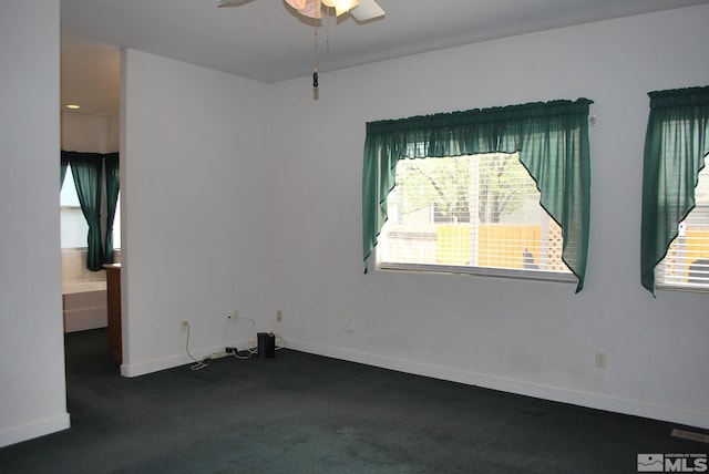 1075 Aster Ln, Fernley, NV 89408 - carpeted spare room featuring a ceiling fan, healthy amount of natural light, and baseboards