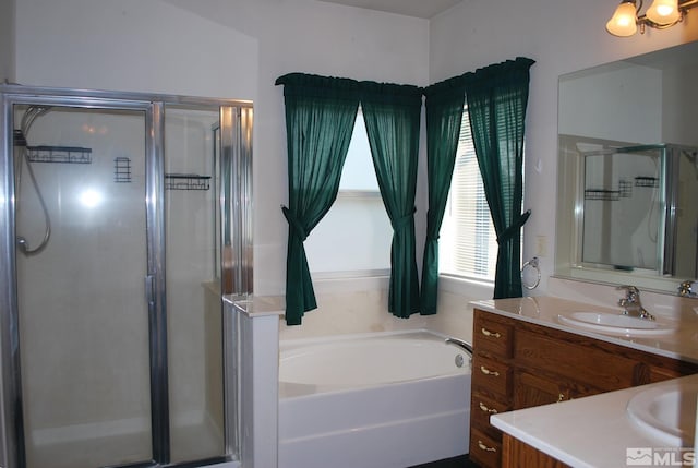 1075 Aster Ln, Fernley, NV 89408 - bathroom featuring a shower stall, vanity, and a bath