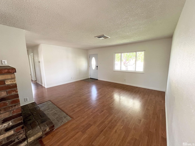 655 Gault Way, Sparks, NV 89431 - unfurnished living room featuring wood finished floors, a textured ceiling, and baseboards