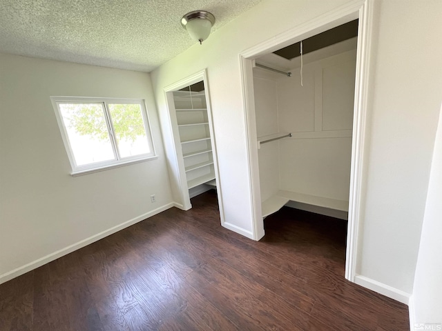 655 Gault Way, Sparks, NV 89431 - unfurnished bedroom with dark wood-type flooring, a textured ceiling, baseboards, and attic access