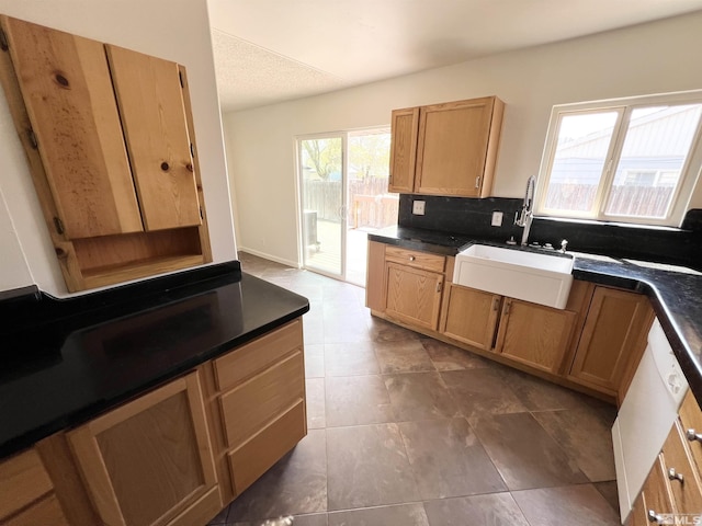 655 Gault Way, Sparks, NV 89431 - kitchen featuring a sink, dark countertops, decorative backsplash, and dark tile patterned flooring