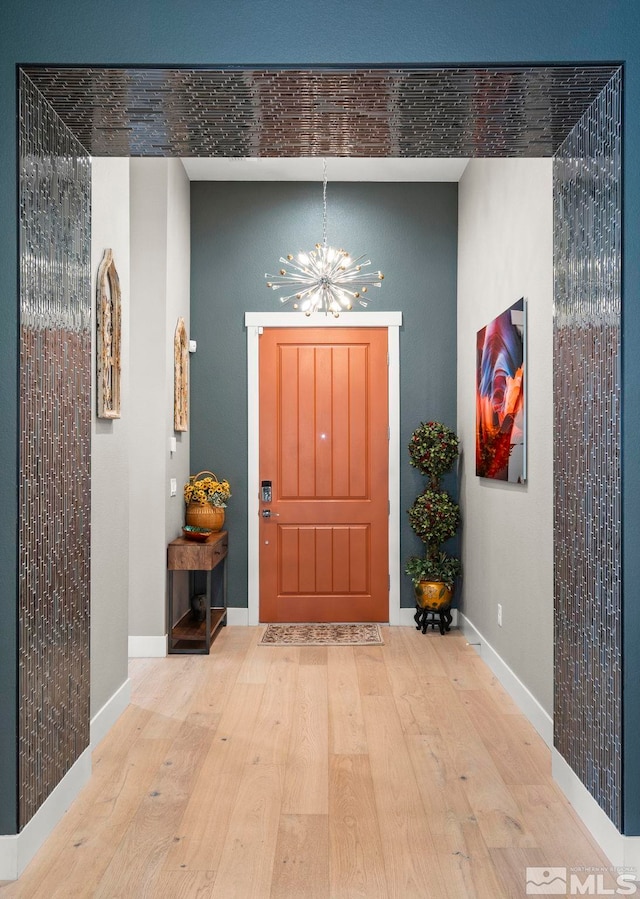 9179 Graycliff Ln, Reno, NV 89523 - entrance foyer with a chandelier, wood finished floors, and baseboards